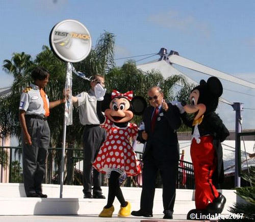 Marty Sklar escorted by Mickey and Minnie