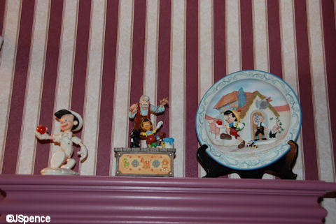 Pinocchio Pieces Above the Toilet