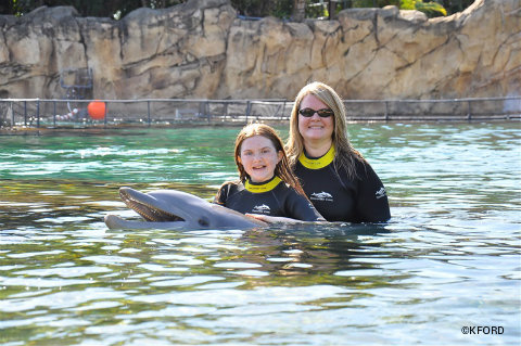 discovery-cove-kristin-lauren-with-dolphin.jpg