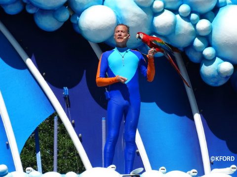 seaworld-orlando-dolphin-days-trainer-with-macaw.jpg