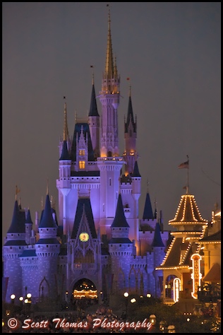 Cinderella Castle in blue as darkness falls over the Magic Kingdom, Walt Disney World, Orlando, Florida