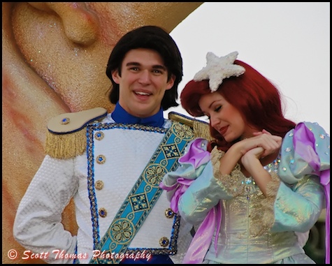 Proud Prince Eric with Princess Ariel in the Magic Kingdom's Celebrate a Dream Come True Parade, Walt Disney World, Orlando, Florida