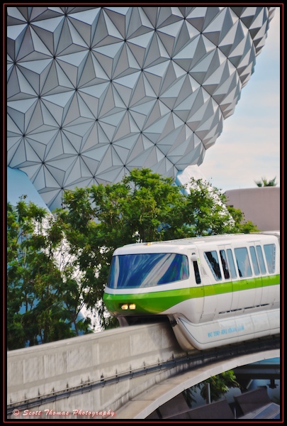 Monorail Lime passing Spaceship Earth on approach to the Epcot station, Walt Disney World, Orlando, Florida.