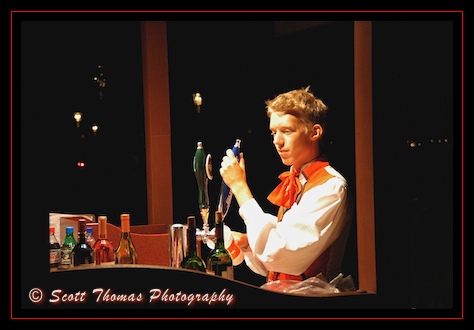 A Norwegian Cast Member pours some spirited beverages at Epcot's Norway Pavilion, Walt Disney World, Orlando, Florida