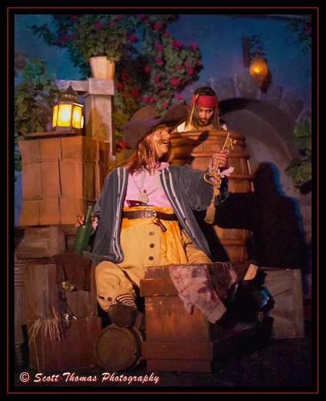 An audio-animatronic Captain Jack Sparrow eyes the key and treasure map of a drunken pirate in a scene from the Pirates of the Caribbean ride in the Magic Kingdom, Walt Disney World, Orlando, Florida