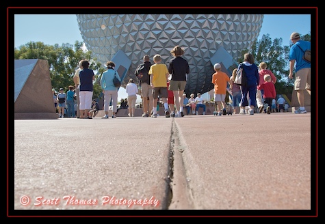 Guests entering Epcot walking towards Spaceship Earth, Walt Disney World, Orlando, Florida