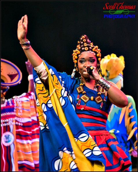 Singer performing during the Festival of the Lion King live show in Africa at Disney's Animal Kingdom, Walt Disney World, Orlando, Florida