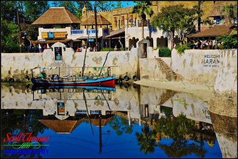 Africa's Harambe Theatre reflected in the Discovery River in Disney's Animal Kingdom, Walt Disney World, Orlando, Florida