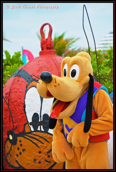 Pluto with his Mount Rustmore likeness on Castaway Cay during a Disney Dream cruise.
