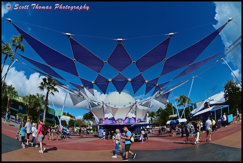 People walk past Pin Central in Epcot's Future World, Walt Disney World, Orlando, Florida