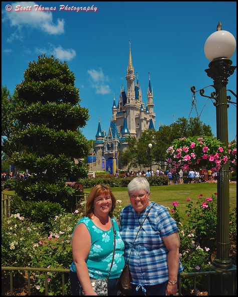 People in front of Cinderella Castle at the Magic Kingdom, Walt Disney World, Orlando, Florida