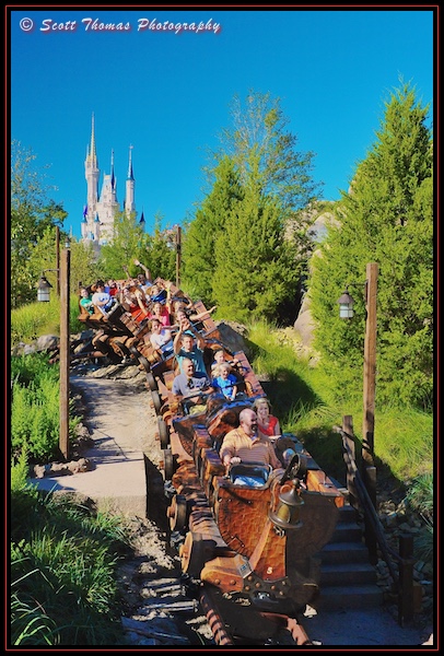 Guests ride the Seven Dwarfs Mine Train in the Magic Kingdom, Walt Disney World, Orlando, Florida