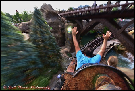 Riding the Seven Dwarfs Mine Train ride in Fantasyland at the Magic Kingdom, Walt Disney World, Orlando, Florida