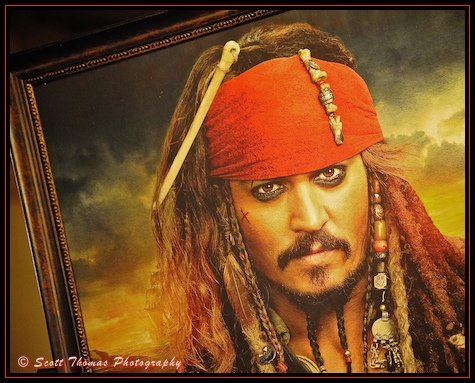 Painting of Captain Jack Sparrow on display in the Pirates Bazaar outside Pirates of the Caribbean in the Magic Kingdom, Walt Disney World, Orlando, Florida.