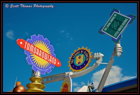 Tomorrowland welcoming signs at the Magic Kingdom, Walt Disney World, Orlando, Florida.
