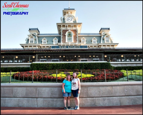 A mother and daughter in front of the Main Street USA Train Station at the Magic Kingdom, Walt Disney World, Orlando, Florida