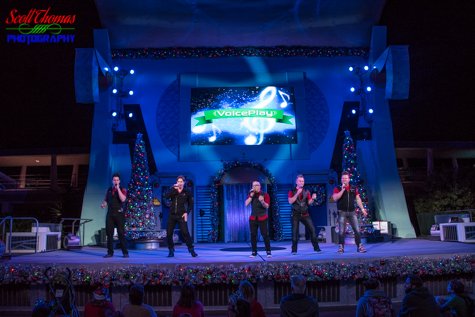 Voiceplay performing on the Rockettower Plaza Stage in Tomorrowland during a Mickey's Very Merry Christmas Party in the Magic Kingdom, Walt Disney World, Orlando, Florida