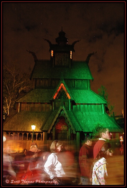 Guests look like Ghosts as they pass the Stave Church in Epcot's Norway pavilion, Walt Disney World, Orlando, Florida