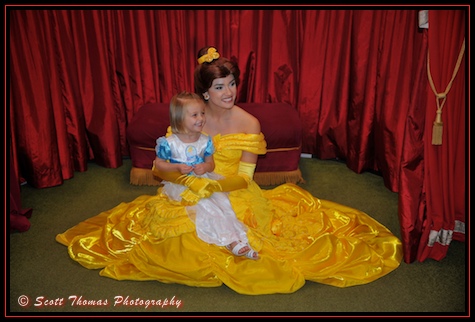Belle in her Yellow Gown meets a young guest at the Magic Kingdom, Walt Disney World, Orlando, Florida