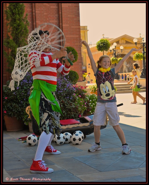 Interactive juggler Sergio entertaining guests at Italy's pavilion in Epcot's World Showcase, Walt Disney World, Orlando, Florida